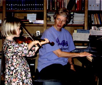 Jody Naifeh and Emma Jane work through a measure in Jody's studio. (c) The Pendleton Family Fiddlers